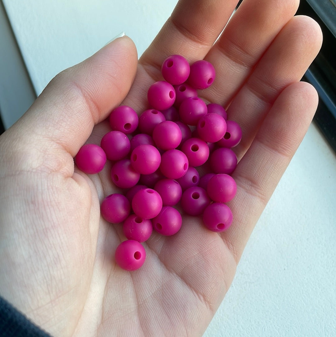We take pride in treating every customer who comes into the store just like  family. We love helping people find the *CLEARANCE* 9mm Dark Pink Silicone  Beads - 10 Beads AJ Craft Supplies